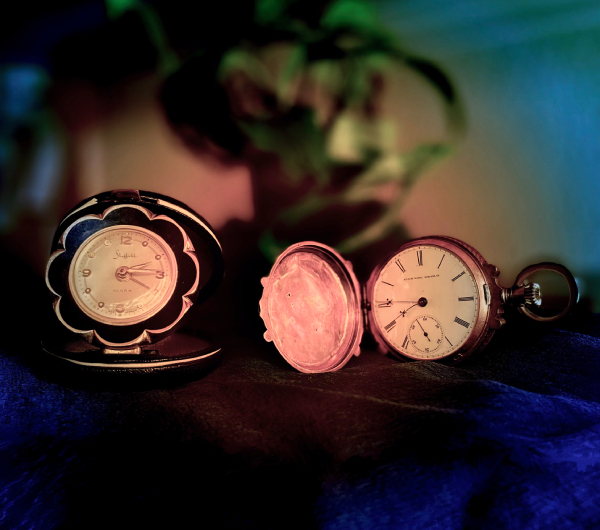 My mother’s 1950s travel clock and an 1872 pocket watch that has been in my father’s family for at least six generations.Photo by A.W.R.